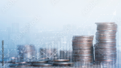 Double exposure city of coins stack for background. Financial investment and success market stock report trading graph economic growth. Business fund and currency exchange concept.