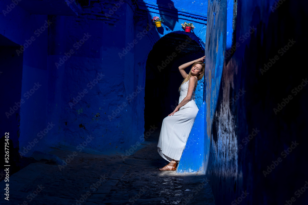 A Model Poses In The Famous City Of Chefchaouen Also Known As The Blue Pearl