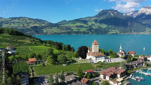 Wallpaper Mural Aerial panoramic view of Spiez Church and Castle on the shore of Lake Thun in the Swiss canton of Bern at sunset, Spiez, Switzerland. Spiez Castle on lake Thun in the canton of Bern, Switzerland. Torontodigital.ca