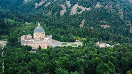 Aerial view of The Sanctuary of Oropa  Roman Catholic building in the Biellese Alps  Northern Italy. Tourist attraction and famous place of pilgrimage in Piedmont. Drone photography.