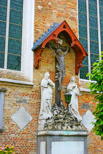 The old Crucifix on wall of Our Lady Church, Bruges, Belgium photo