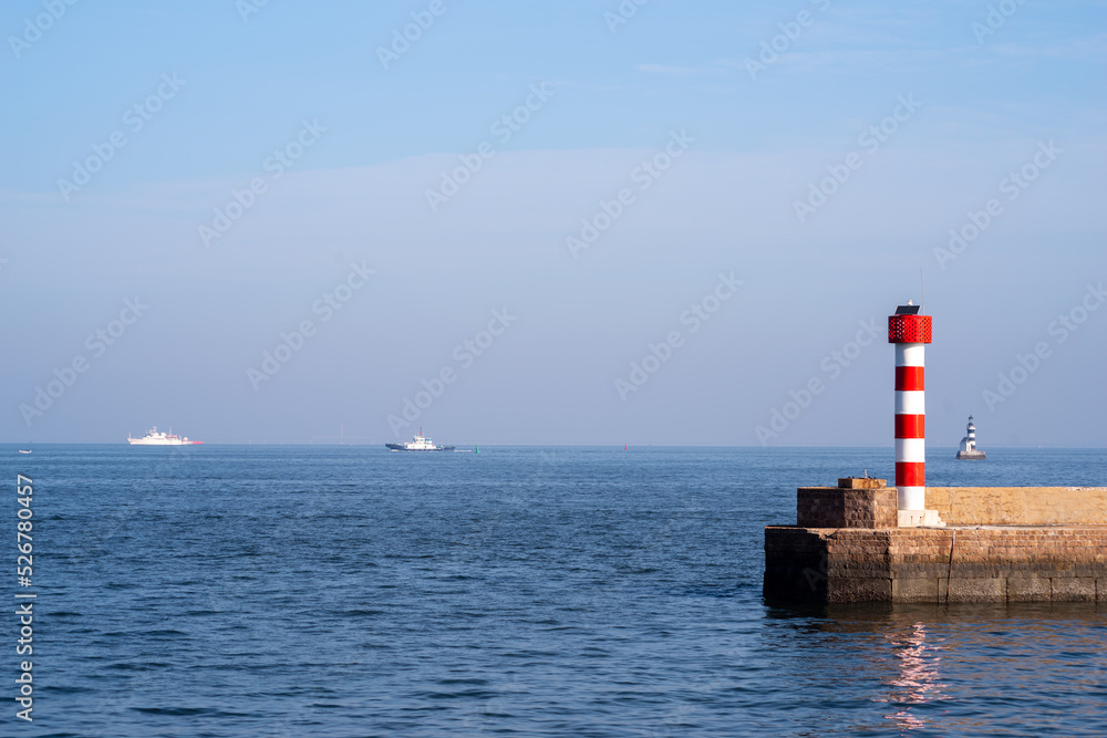 Little red and white striped lighthouse