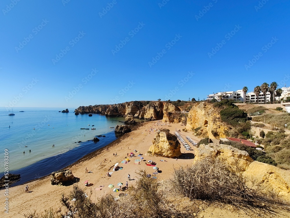 Praia Dona Ana beach with turquoise sea water and cliffs, Portugal. Beautiful Dona Ana Beach (Praia Dona Ana) in Lagos, Algarve, Portugal.
Praia Dona Ana beach with turquoise sea water and cliffs, Portugal. Beautiful Dona Ana Beach (Praia Dona Ana) in Lagos, Algarve, Portugal.