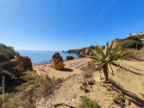 Praia Dona Ana beach with turquoise sea water and cliffs, Portugal. Beautiful Dona Ana Beach (Praia Dona Ana) in Lagos, Algarve, Portugal.
 photo