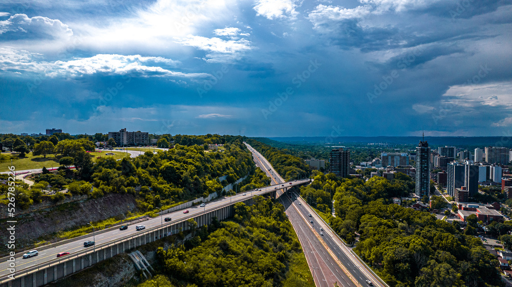 Aerial drone shot of the roads taking to the skyscrapers of the city