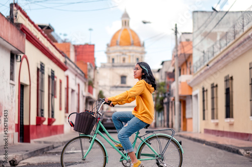 Photography Young woman on a bicycle