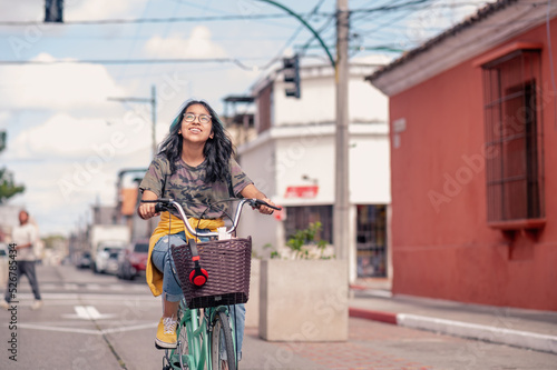 Photography Hispanic girl riding a bicycle