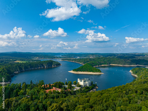 Czechia  Orlik Castle and Vltava River Aerial View. Czech Republic. Beautiful Summer Green Landscape with Orl  k Water Reservoir and Boats. View from Above. 