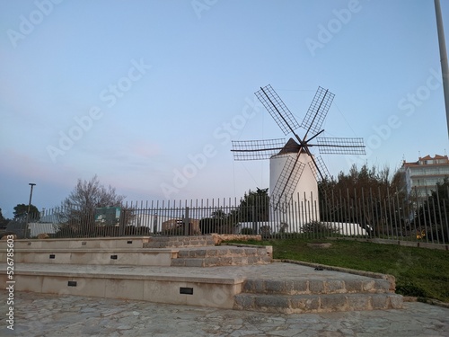 white windmill in europe at sunset. Travel concept photo