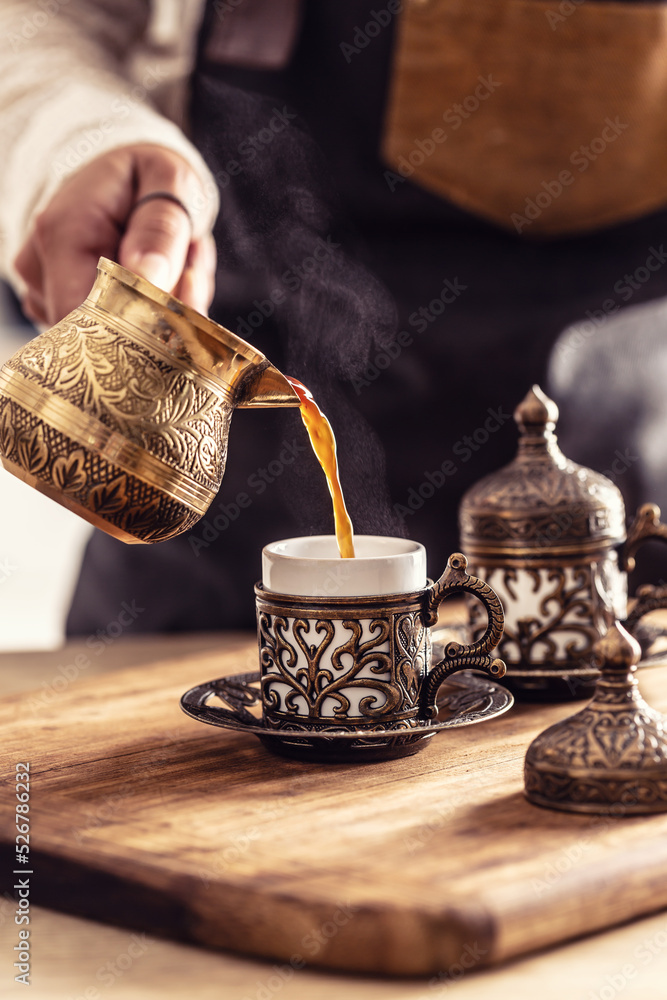 Dzezva jezve or cezve coffee made ina traditional way poured into old traditional utensils Stock Photo Adobe Stock
