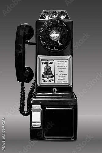 Fotobehang Black and White photo of a classic Western Electric rotary-dial payphone commonly used throughout the United Staes of America prior to the adoption of the push-button dial phone