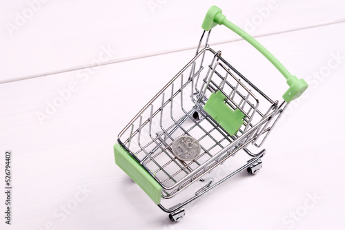 Empty mini shopping cart on the table, top view