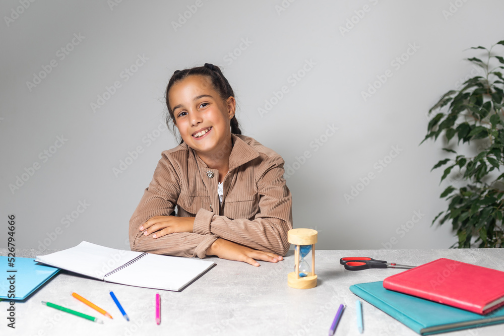Little Girl doing homework on desk
