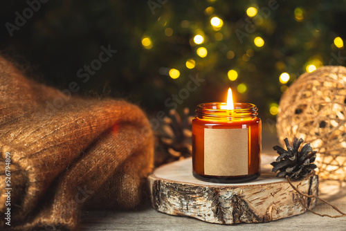 Christmas Holiday burning candle in a glass jar