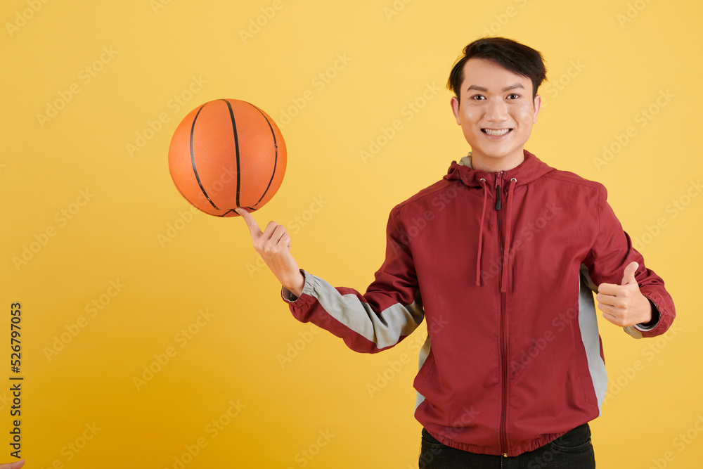 Man Spinning Basketball Ball on Finger
