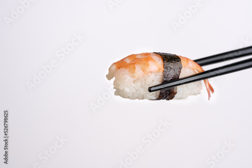 SHRIMP NIGIRI SUSHI CHOPSTICK WHITE BACKGROUND 