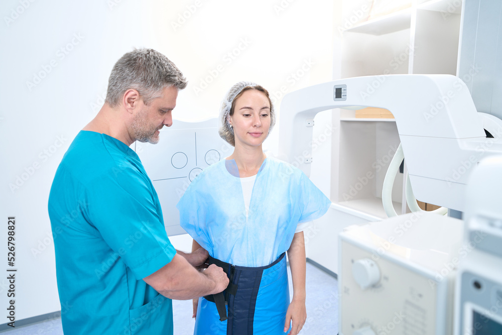 Doctor and patient in radiology department in clinic Doctor and patient in radiology department in clinic