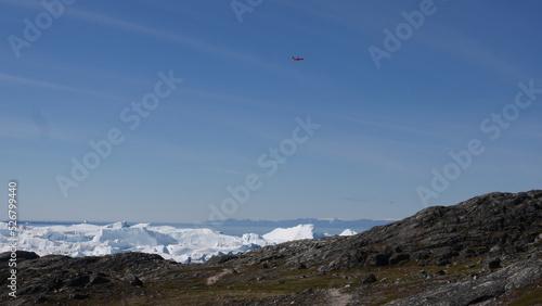 Aircraft flies over icebergs in Greenland