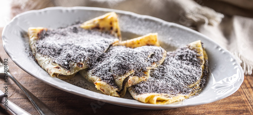 Traditional Slovak and Czech potato dumplings with popy seeds and sugar. photo