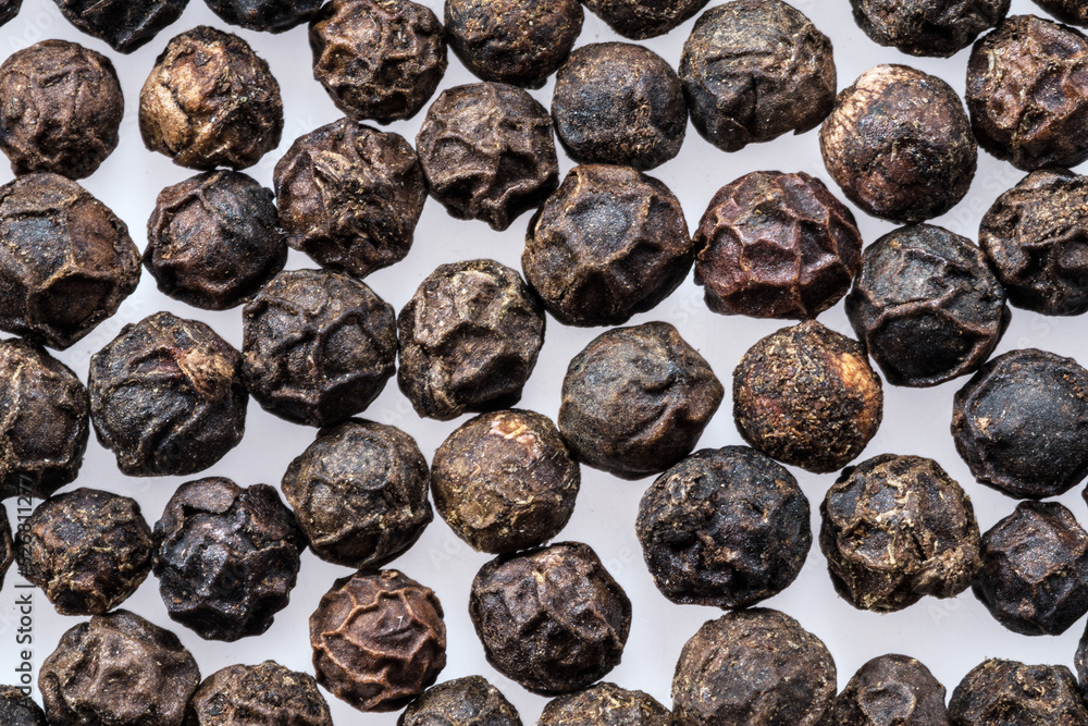 Black peppercorns isolated on white background. Black peppercorns isolated on white background.