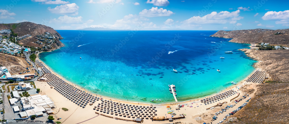 Panoramic aerial view of the popular Elia beach at the island of Mykonos, Cyclades, Greece, during summer time - obrazy, fototapety, plakaty 