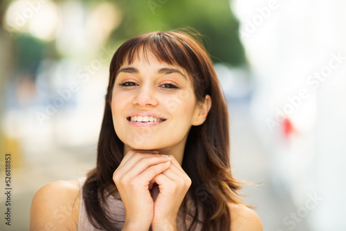 Close up portrait of beautiful young woman outside