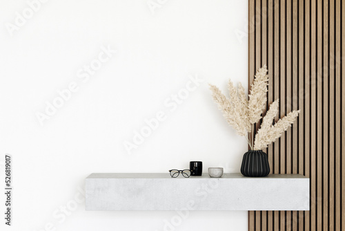 Fototapeta Naklejka Na Ścianę i Meble -  Console concrete table with decor and dried flowers. Hallway in the apartment. Wooden slats on the wall. 3d render