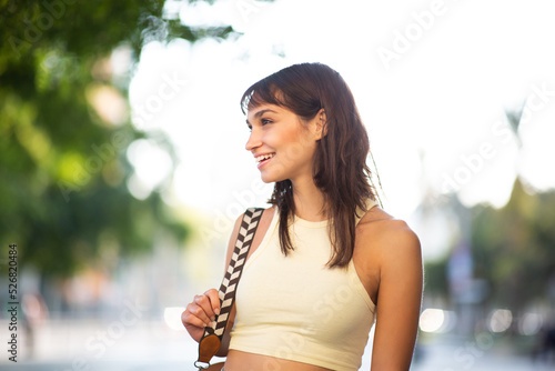 Attractive young woman standing outside