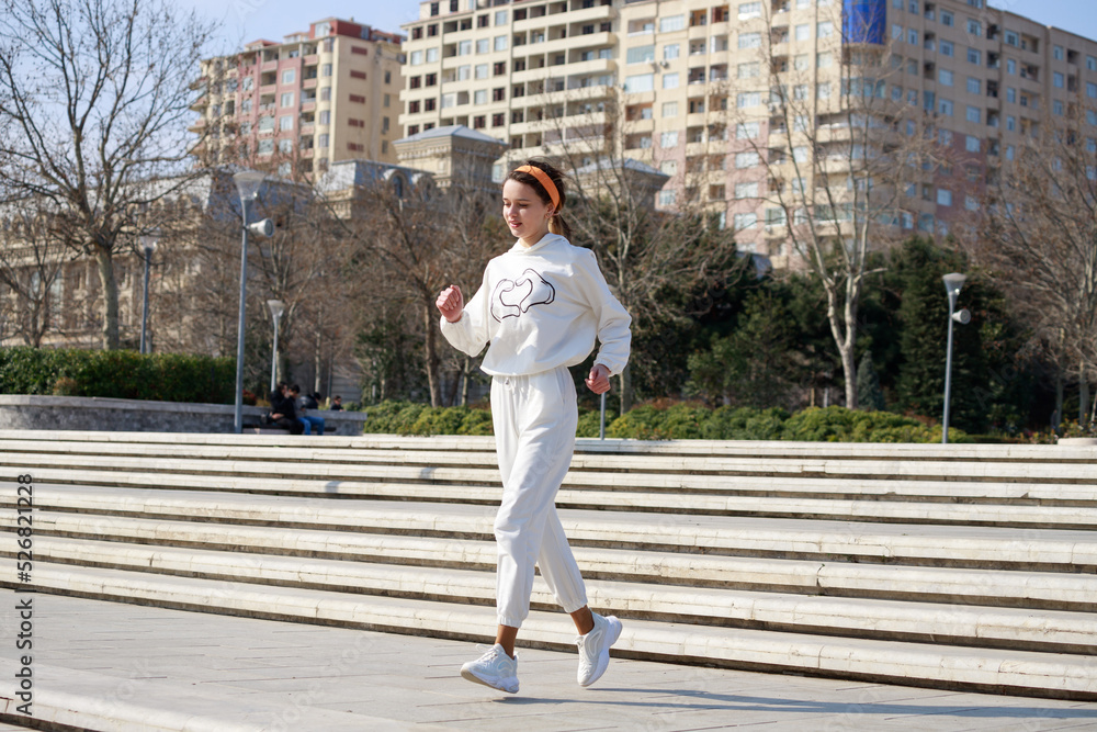 Young girl running a t the park