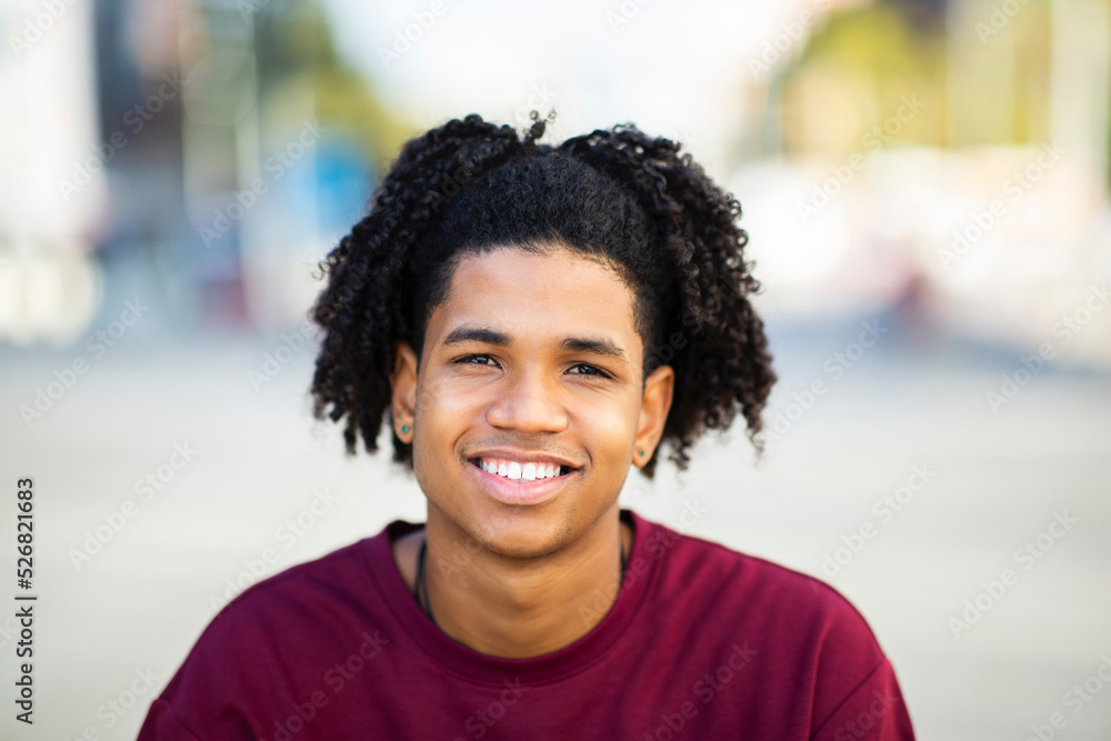 Smiling african american man outdoors in city Smiling african american man outdoors in city