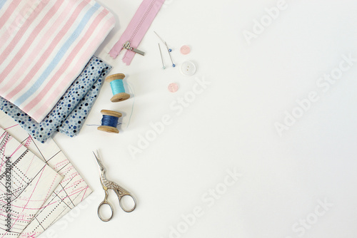 tailor workspace with sewing and handmade tools white desk background top view mock up