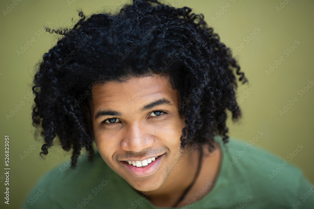 Fototapeta premium Face of smiling black man with curly hair