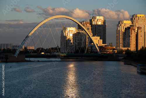 Nursultan, Kazakhstan, August 2022. View of the bridge on the embankment of the Yesil River at sunset. High quality photo