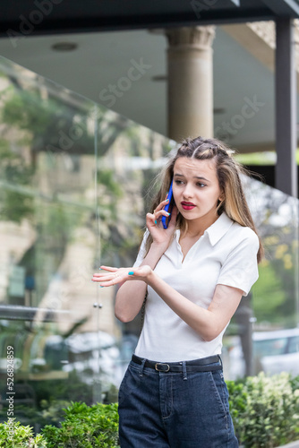 Vertical photo of cute lady talking on the phone