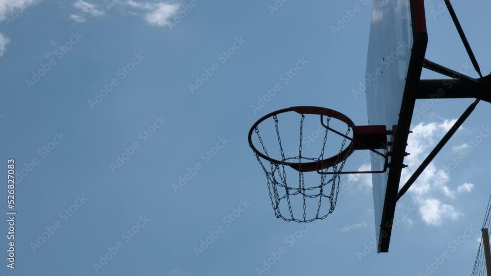 Accurate basketball hitting the ring. Precise throw. Closeup cinematic shot