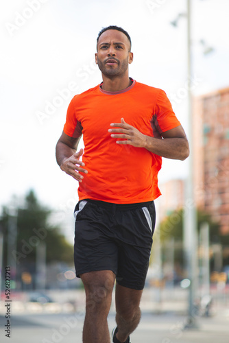 Athlete jogging outdoors in city