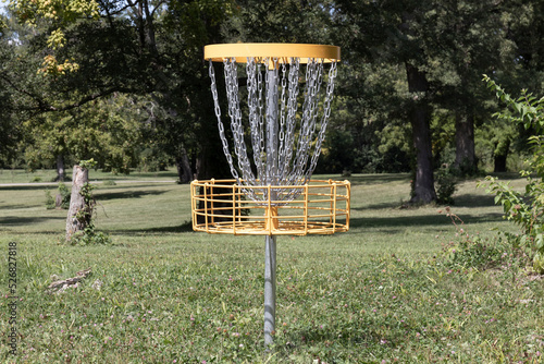 Standard Disc Golf basket or target. Disc Golf is played over 9 or 18 holes and shares many rules with traditional golf. photo