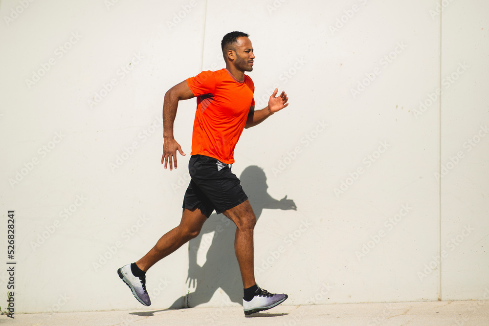 Man jogging outdoors on a bright sunny day Man jogging outdoors on a bright sunny day