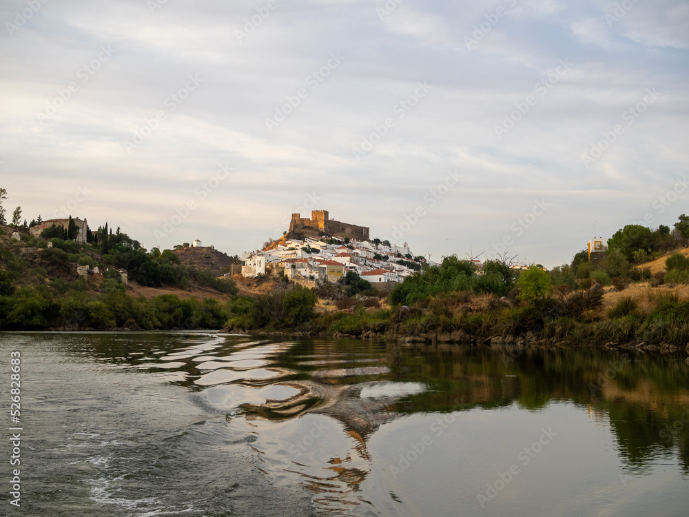 Mertola village topped by the castle seen from Guadiana River
