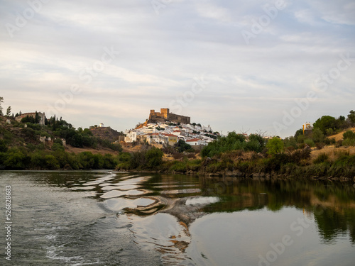 Mertola village topped by the castle seen from Guadiana River