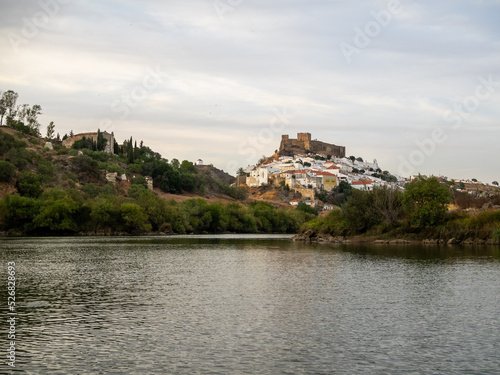 Mertola village topped by the castle seen from Guadiana River