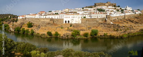 Panorama of Mertola village, by Guadiana River, with it's white houses and the Castle above photo