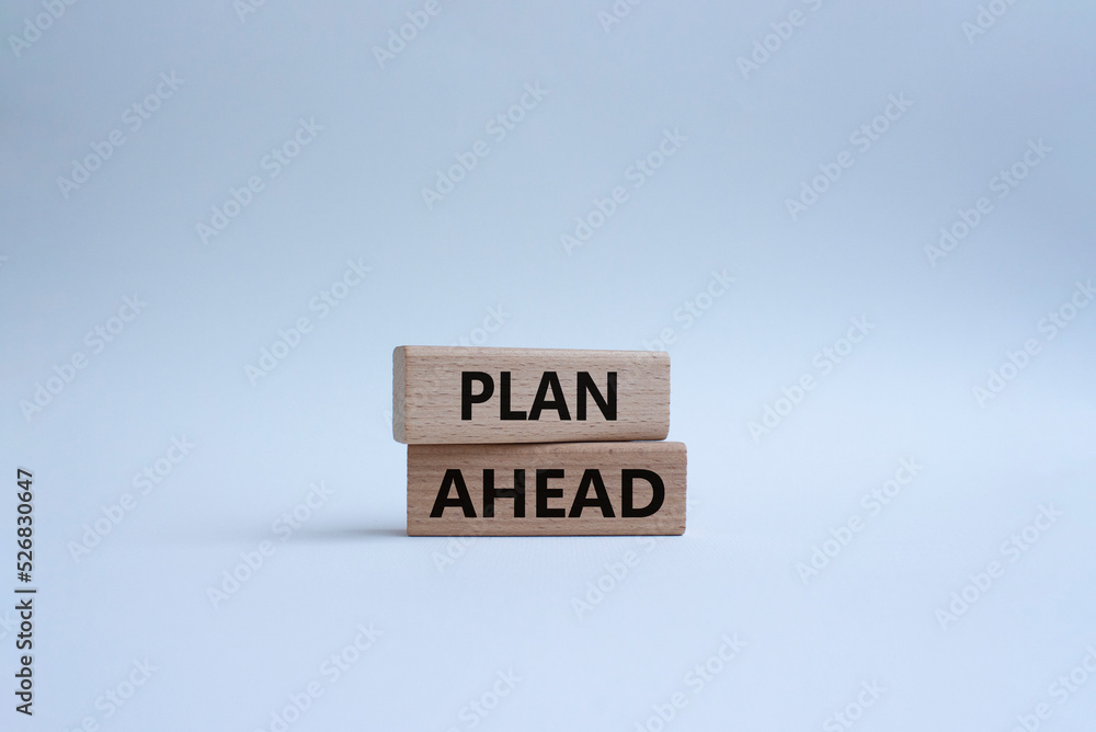 Plan ahead symbol. Wooden blocks with words Plan ahead. Beautiful white background. Businessman hand. Business and Plan ahead concept. Copy space.