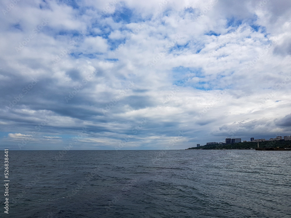 Seascape Sea with calm water and white clouds Seascape Sea with calm water and white clouds
