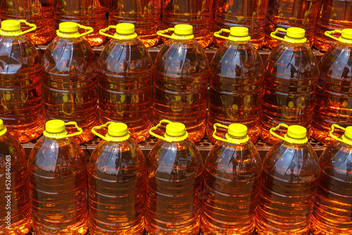 Many bottles of freshly squeezed sunflower oil are in the open air.