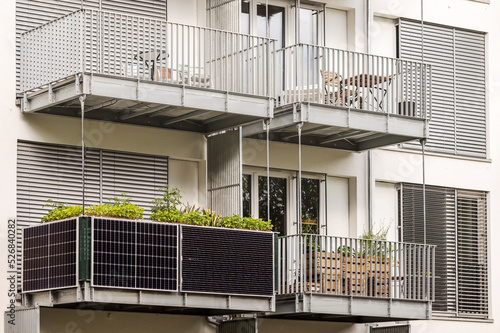 Fényképezés Solar panels on Balcony of Apartment Building in City