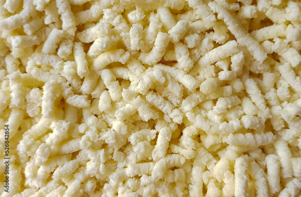 Shredded cheese in the foreground
Shredded cheese in the foreground