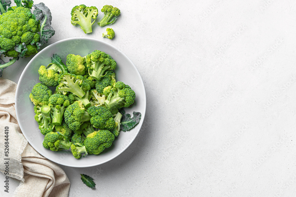 Broccoli in a gray plate on a light background. Healthy food. Top view, copy space Broccoli in a gray plate on a light background. Healthy food. Top view, copy space