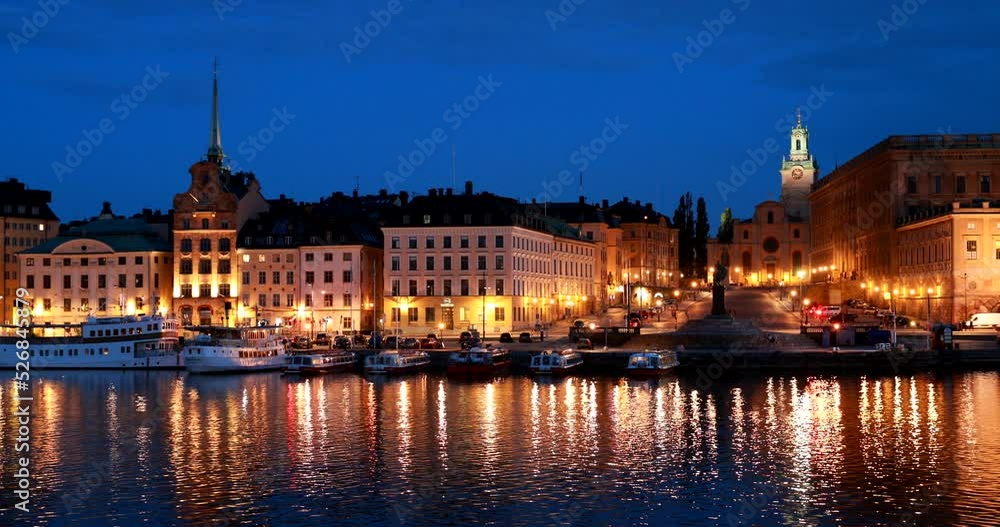 Stockholm, Sweden. Scenic Night View Of Embankment In Old Town Of Stockholm At Summer. Gamla Stan In Summer Evening. Famous Popular Destination Scenic Place And UNESCO World Heritage Site. Stockholm, Sweden. Scenic Night View Of Embankment In Old Town Of Stockholm At Summer. Gamla Stan In Summer Evening. Famous Popular Destination Scenic Place And UNESCO World Heritage Site.