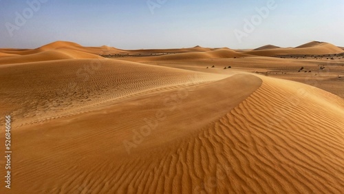 Fotografia Beautiful view of a sand dunes under the calm blue sky